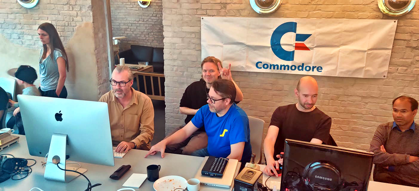 People coding and playing at at retro computer party in Copenhagen